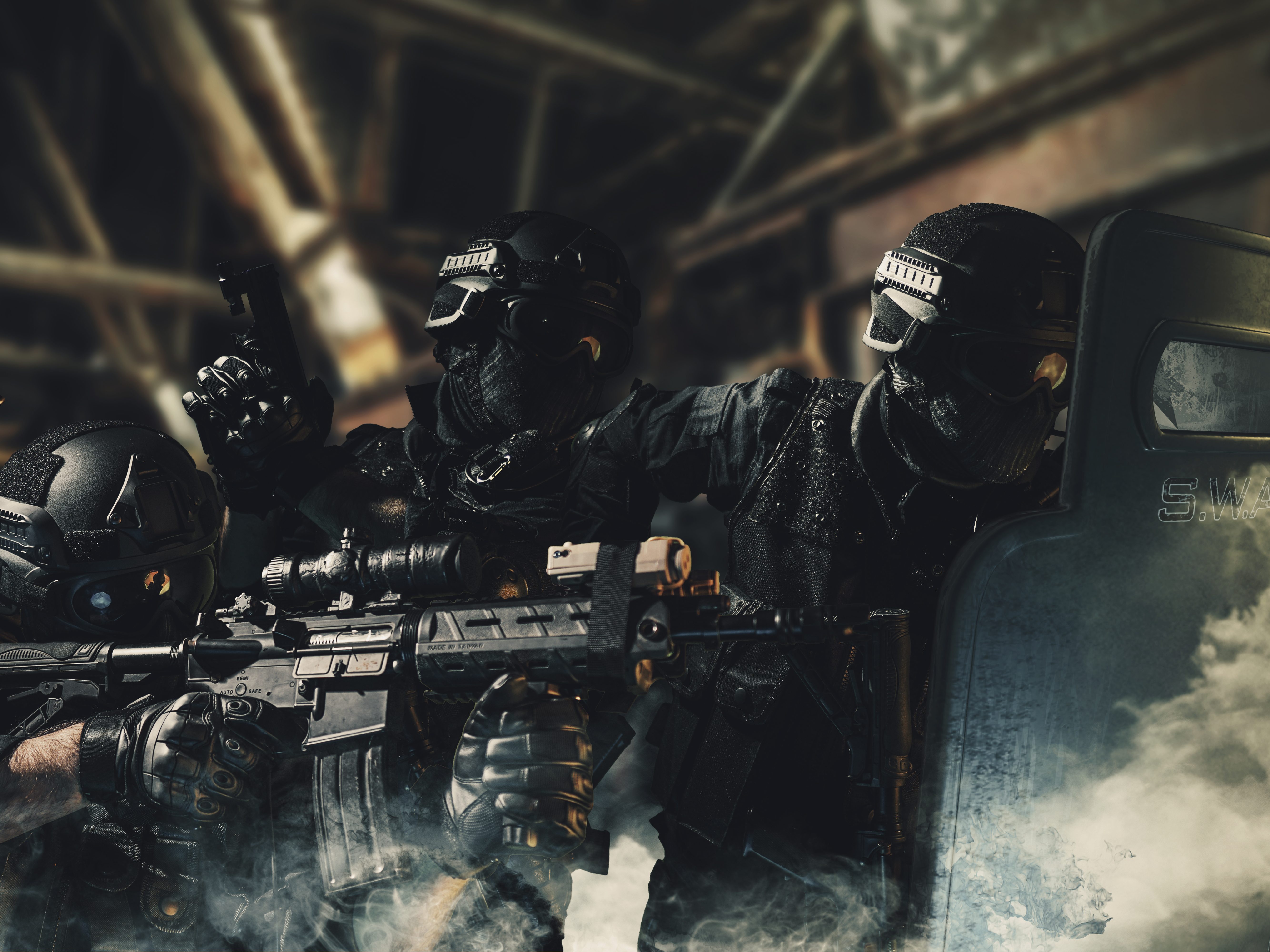 Heavily armed SWAT team in tactical gear advancing through smoke with rifles, sidearms, and a ballistic shield—illustrating the demands for reliable, mission-ready law enforcement ammunition.